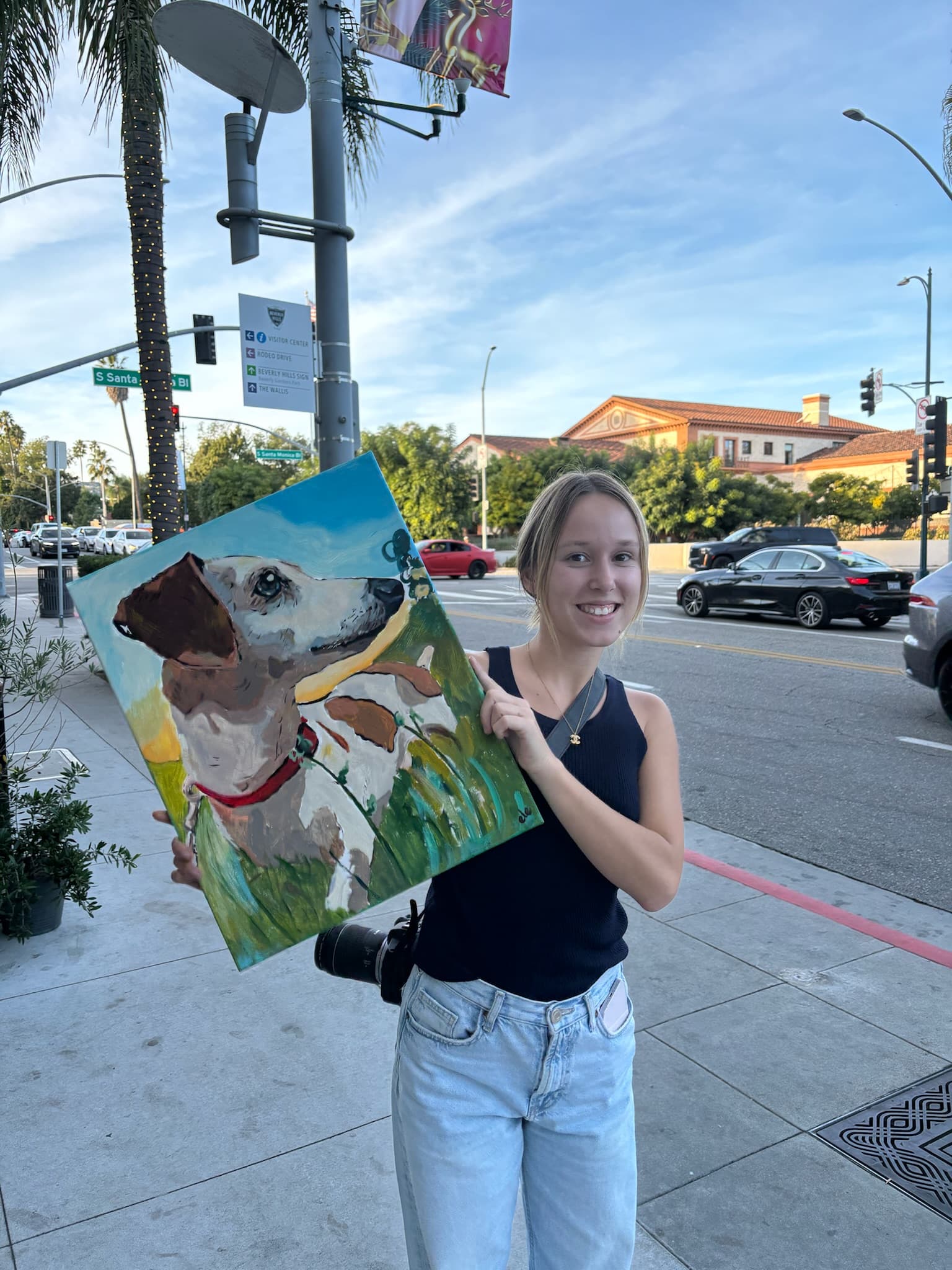 Client holding a finished commissioned dog portrait