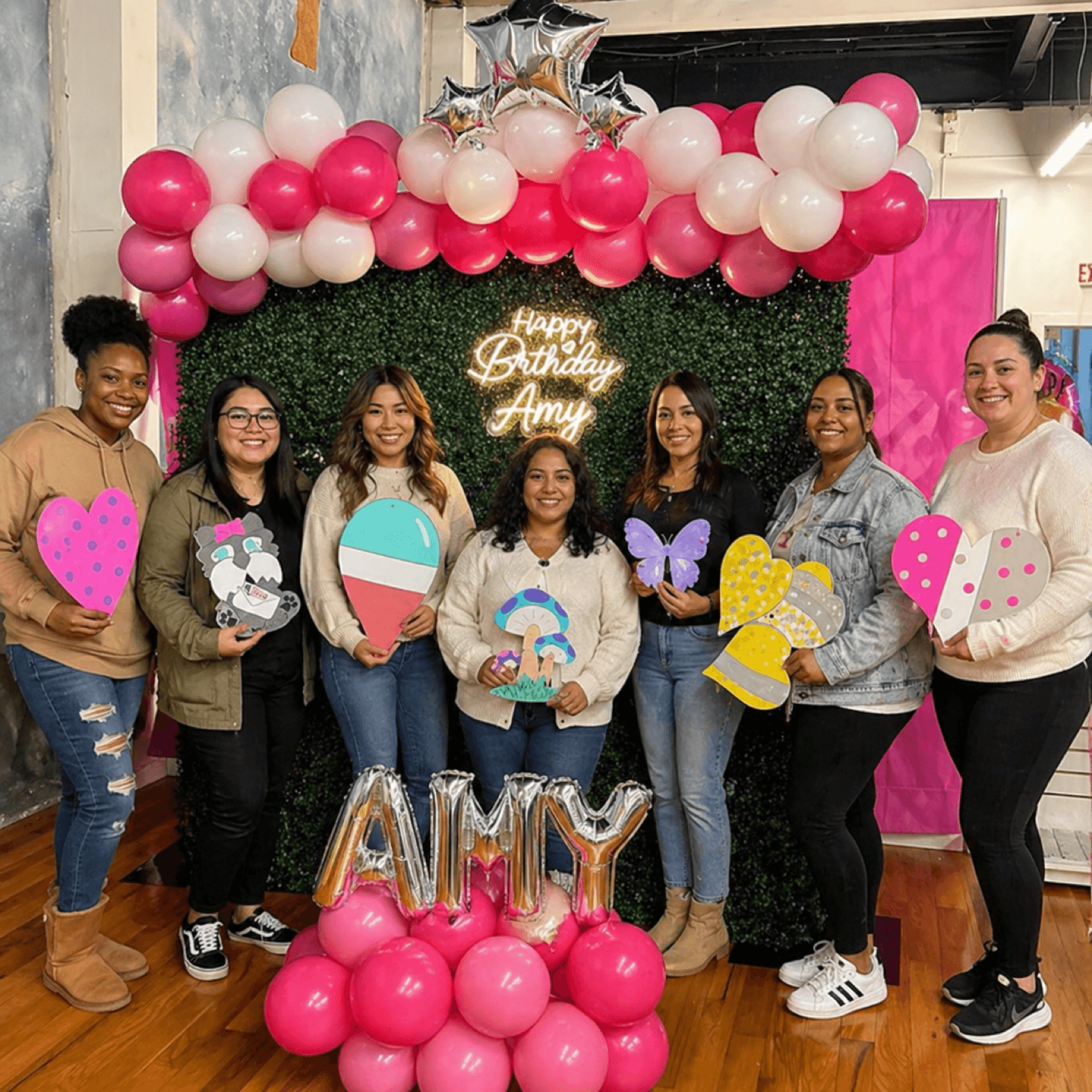 A father and toddler doing dot painting together at a family art event